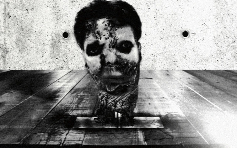 One of the still frames of the severed head (original image replaced in compliance with Fandom Terms of Use).